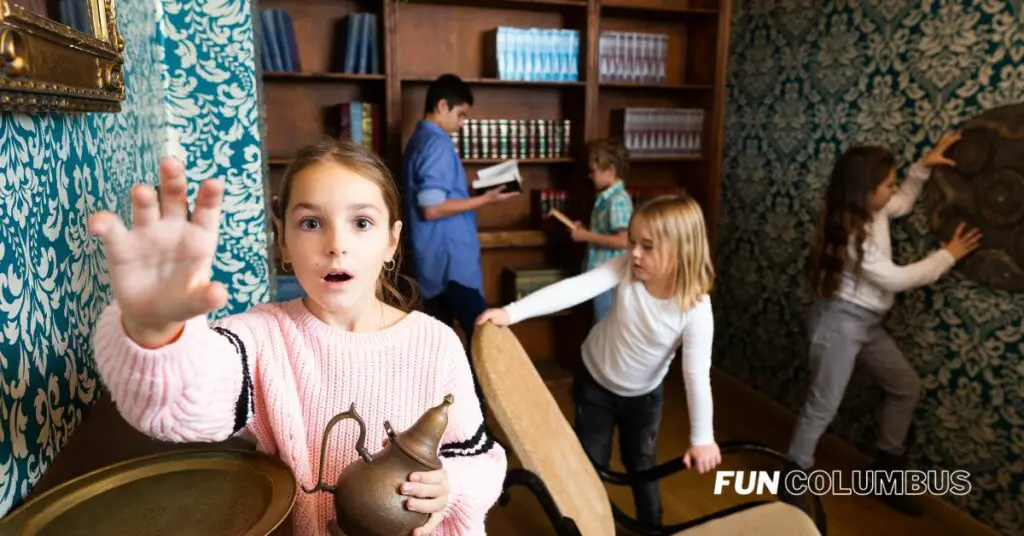 Childrens solving a puzzle in an escape room in Columbus, Ohio